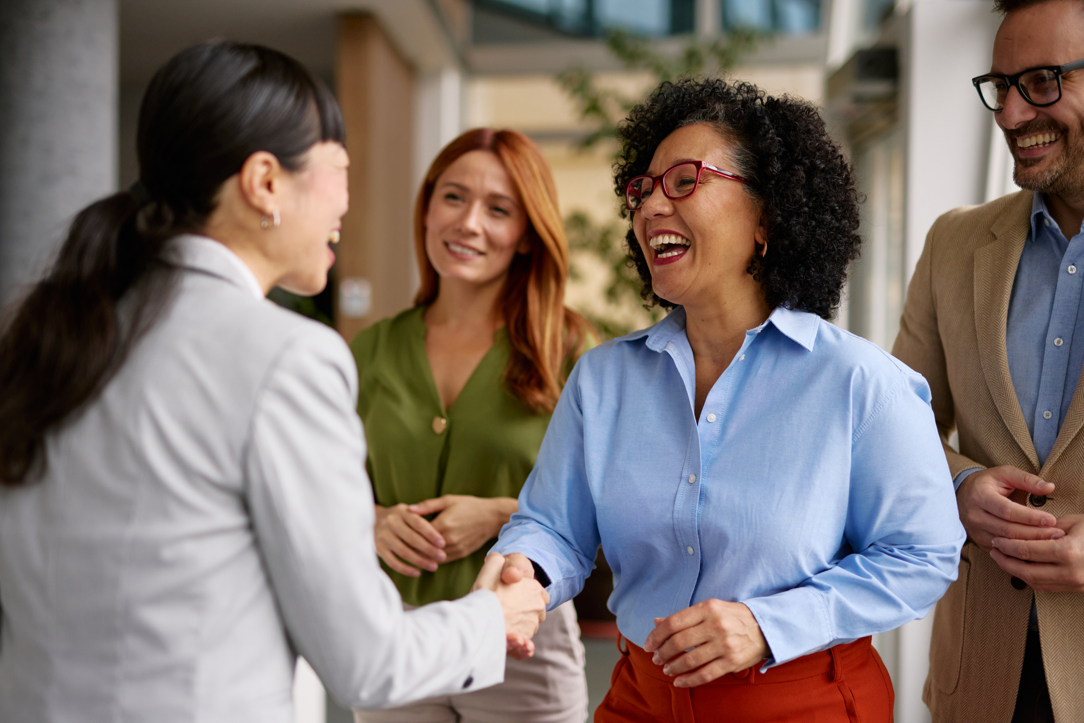 Four people meeting at a networking event.