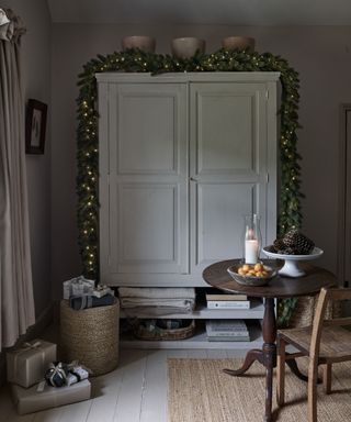 Grey cabinet, wreath with fairy lights