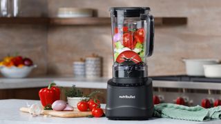 Nutribullet Power Core blender containing vegetables on kitchen counter