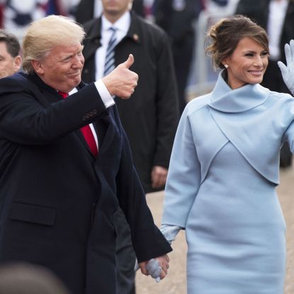 Face, Sleeve, Coat, Suit, Formal wear, Gesture, Tie, Blazer, Greeting, Holding hands, 