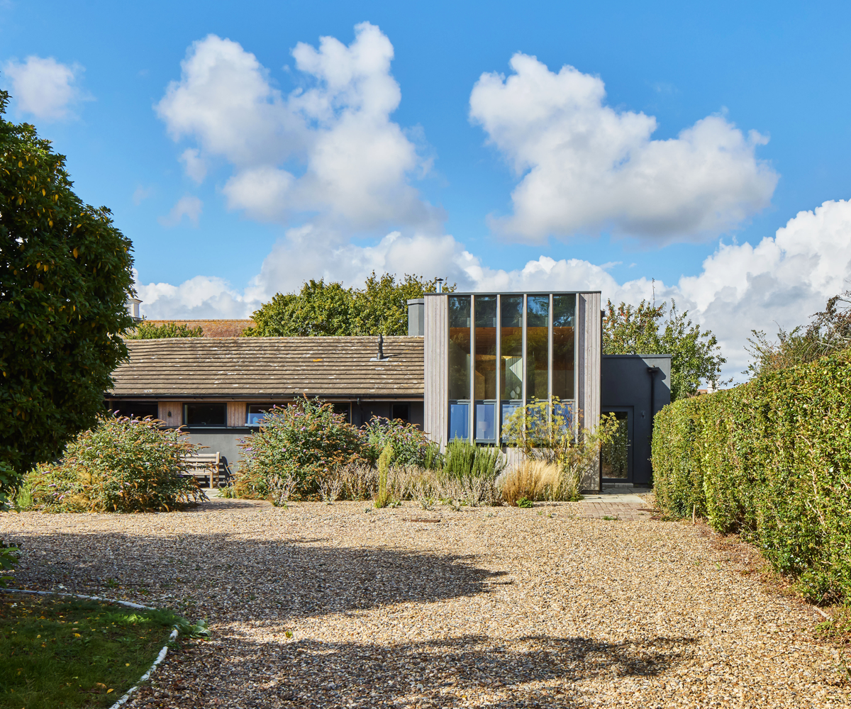 exterior of glazed extended bungalow with gravel driveway