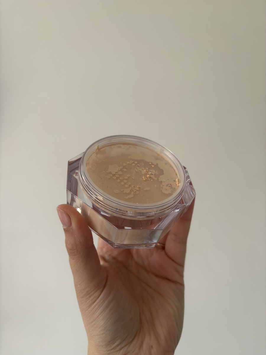 Mica Ricketts holding Fenty Beauty Pro Filt'r Instant Retouch Setting Powder