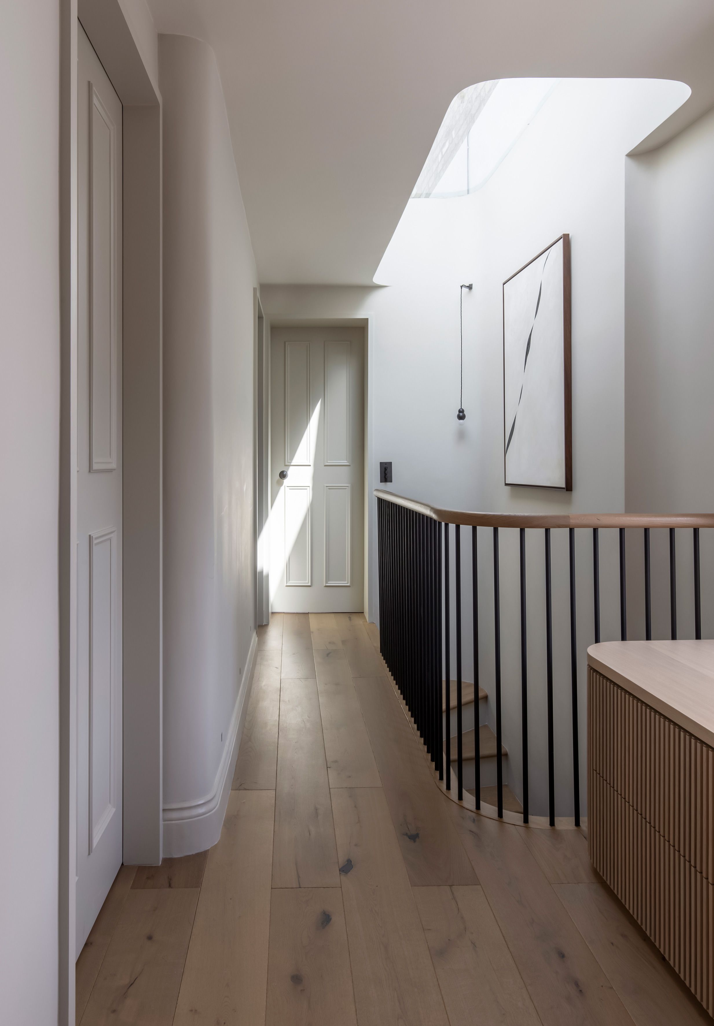 Light filled landing with sky light