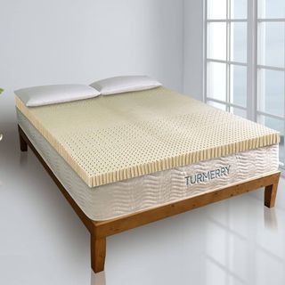 Latex Mattress Topper on a bed.