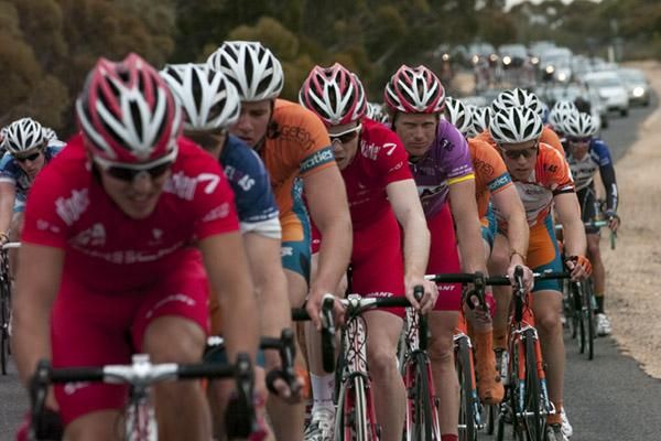 Tour leader Stuart Shaw (Drapac Porsche) in fifth wheel as the peloton give chase to two riders up ahead.