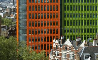 Bright, bold orange and greet building blocks in city