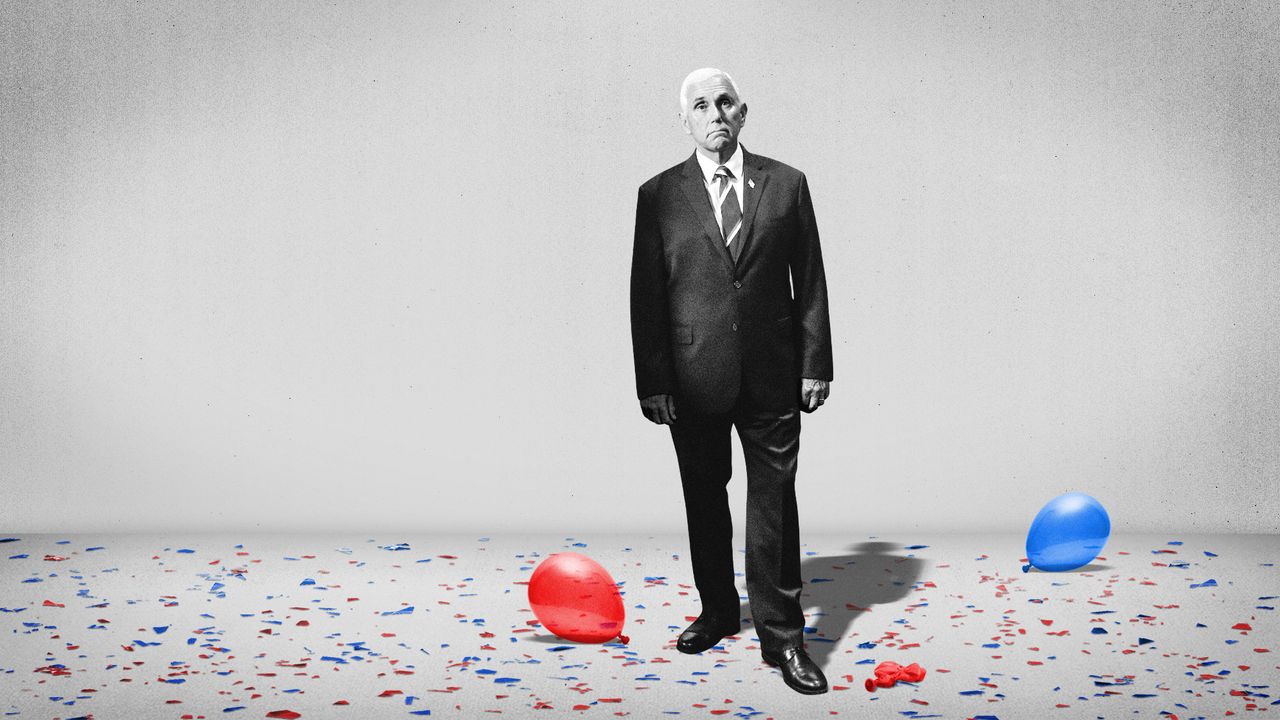 Mike Pence standing amid confetti and balloons