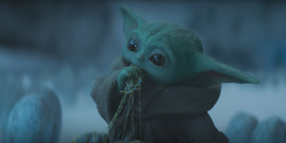 the mandalorian star wars baby yoda eating egg spider creature