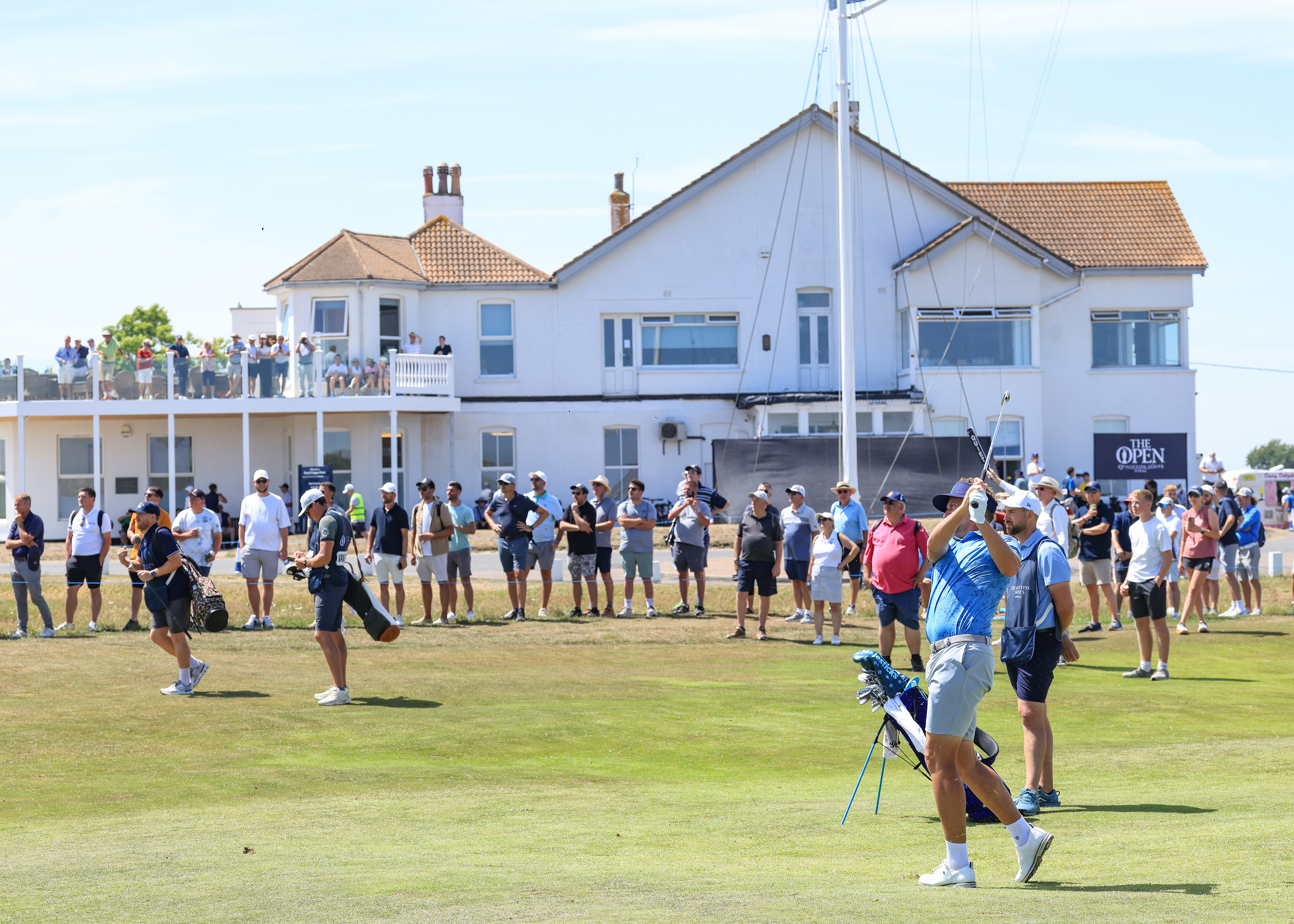 Ian Poulter hits a golf shot from the middle of the fairway