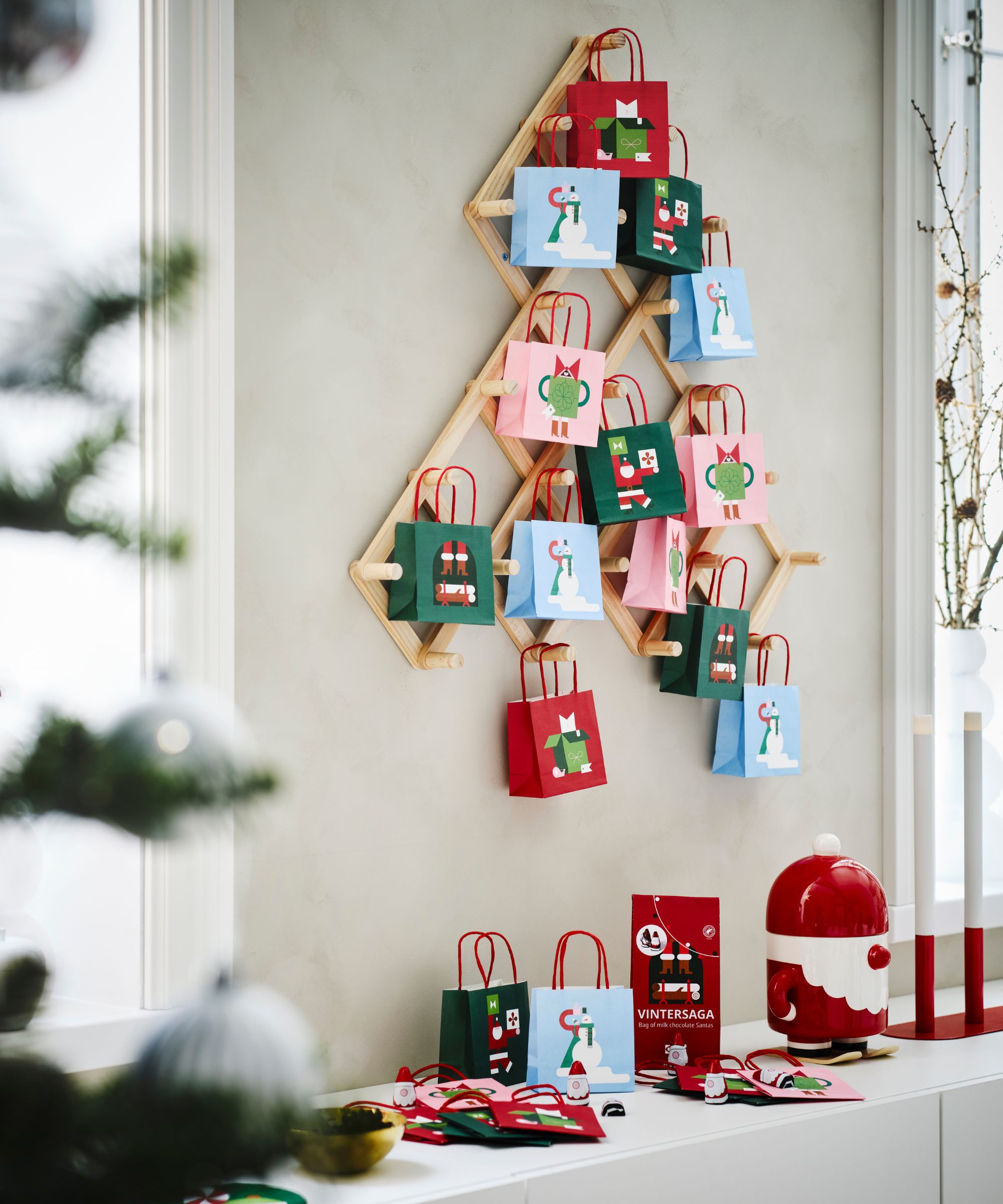 DIY Advent calendar made from a wall mounted storage unit and paper gift bags