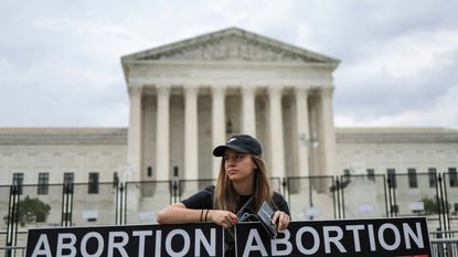 picture of protester in front of U.S. Supreme Court after abortion ruling