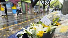Flowers are placed at the site of the knife attack in Suzhou