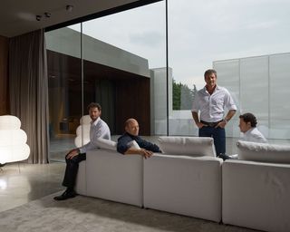 Minotti Brothers: Roberto and Renato’s singular vision continues to uplift. Pictured: Brothers Renato and Roberto Minotti, flaked by Renato’s twin sons Alessio and Alessandro in the Minotti showroom outside Milan as originally featured in W*162.