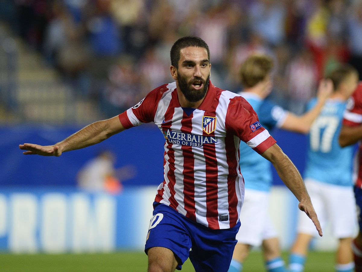 Turan signs new Atletico deal | FourFourTwo