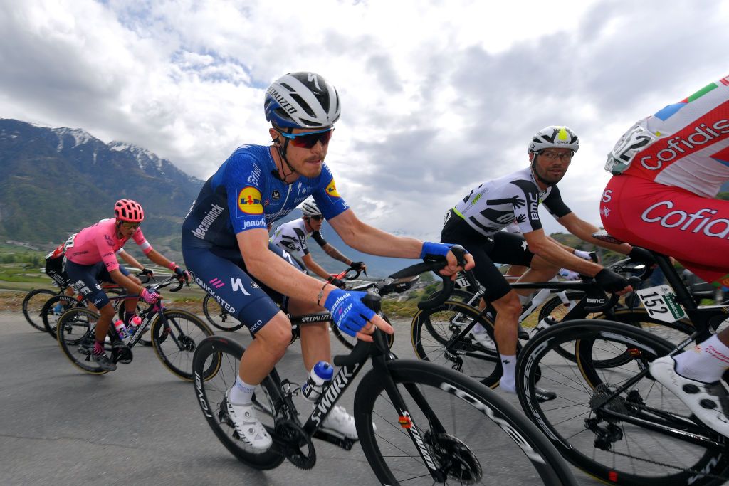 MARTIGNY SWITZERLAND APRIL 28 Remi Cavagna of France and Team Deceuninck QuickStep Reinardt Janse Van Rensburg of South Africa and Team Qhubeka Assos during the 74th Tour De Romandie 2021 Stage 1 a 1681km stage from Aigle to Martigny TDR2021 TDRnonstop UCIworldtour on April 28 2021 in Martigny Switzerland Photo by Luc ClaessenGetty Images