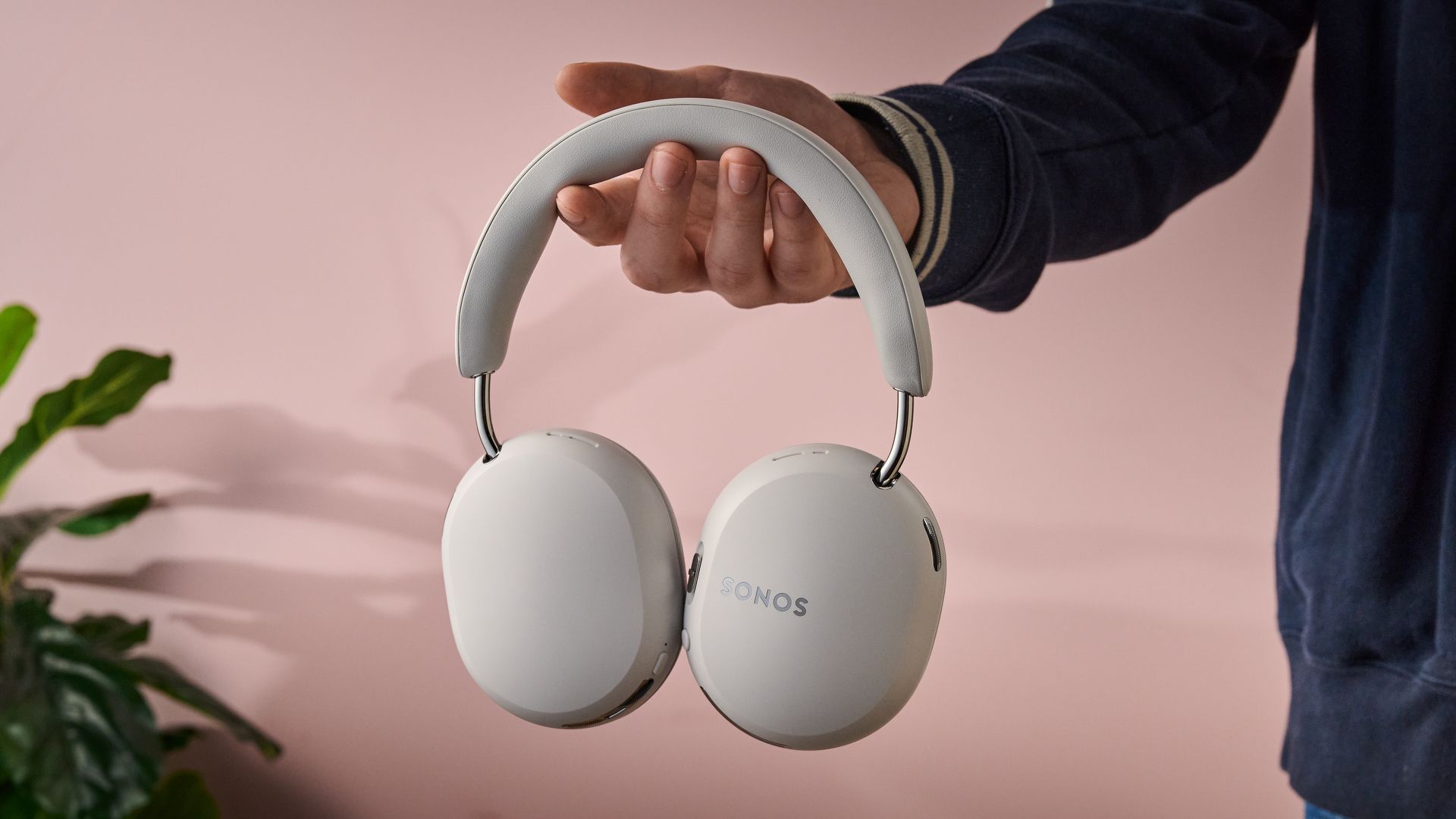 Man holding the Sonos Ace Ultra
