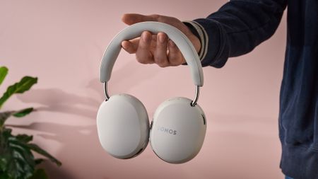 Man holding the Sonos Ace Ultra