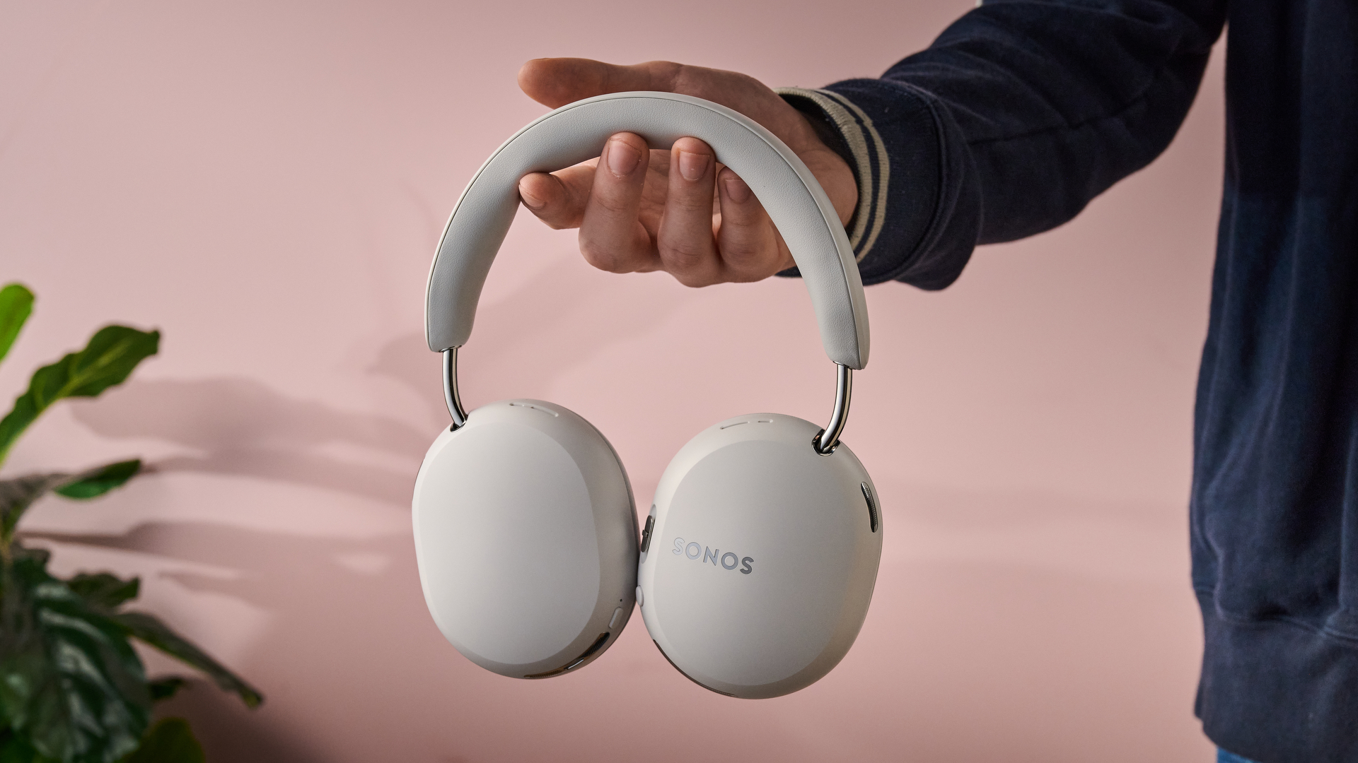 Man holding the Sonos Ace Ultra
