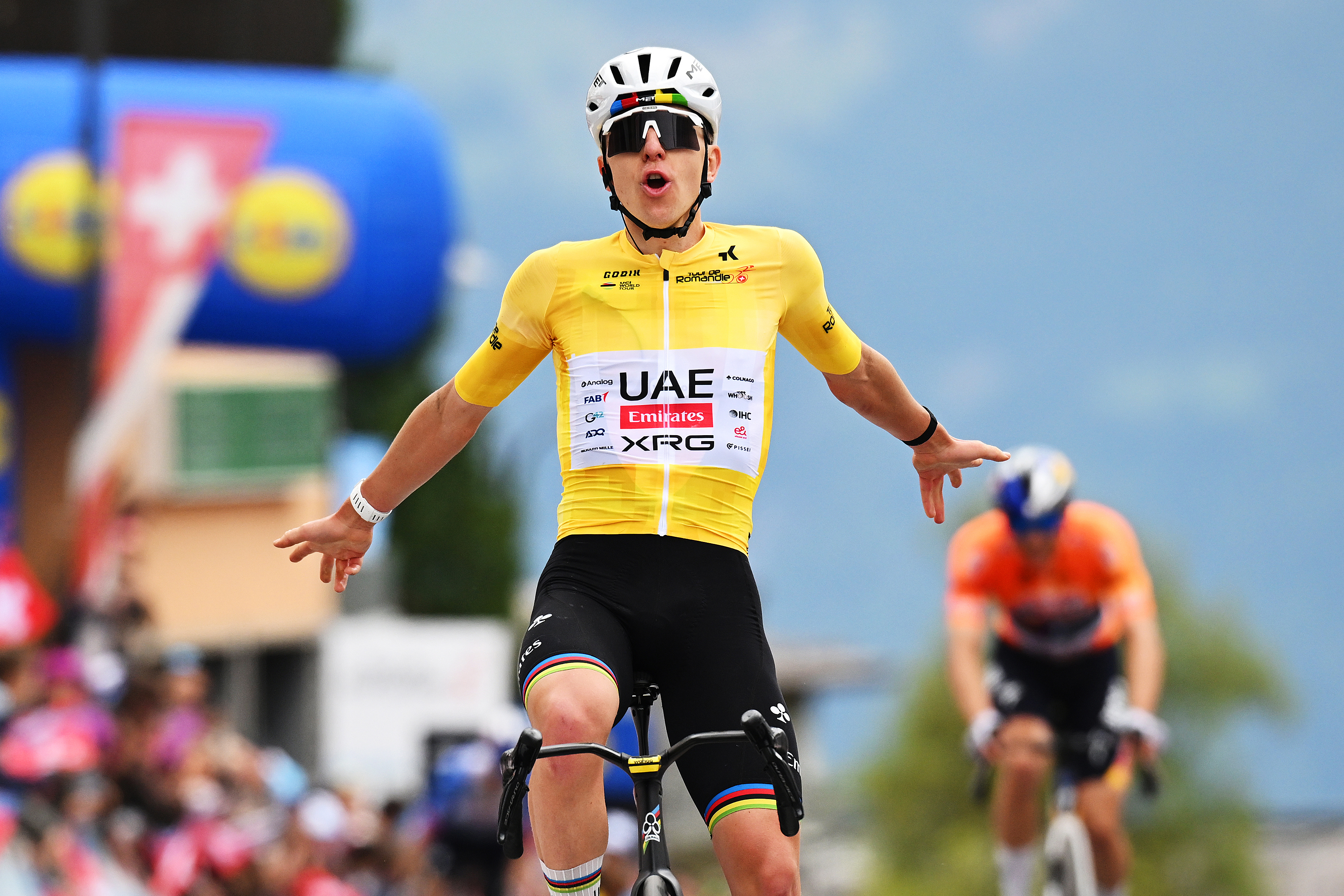 Tadej Pogačar celebrates victory at the finish line of stage 5 of the Tour de Romandie 2026