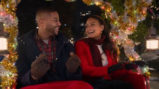 Teddy (Devale Ellis) and Layla (Christina Milian) on a sleigh ride in Netflix's "Meet Me Next Christmas"