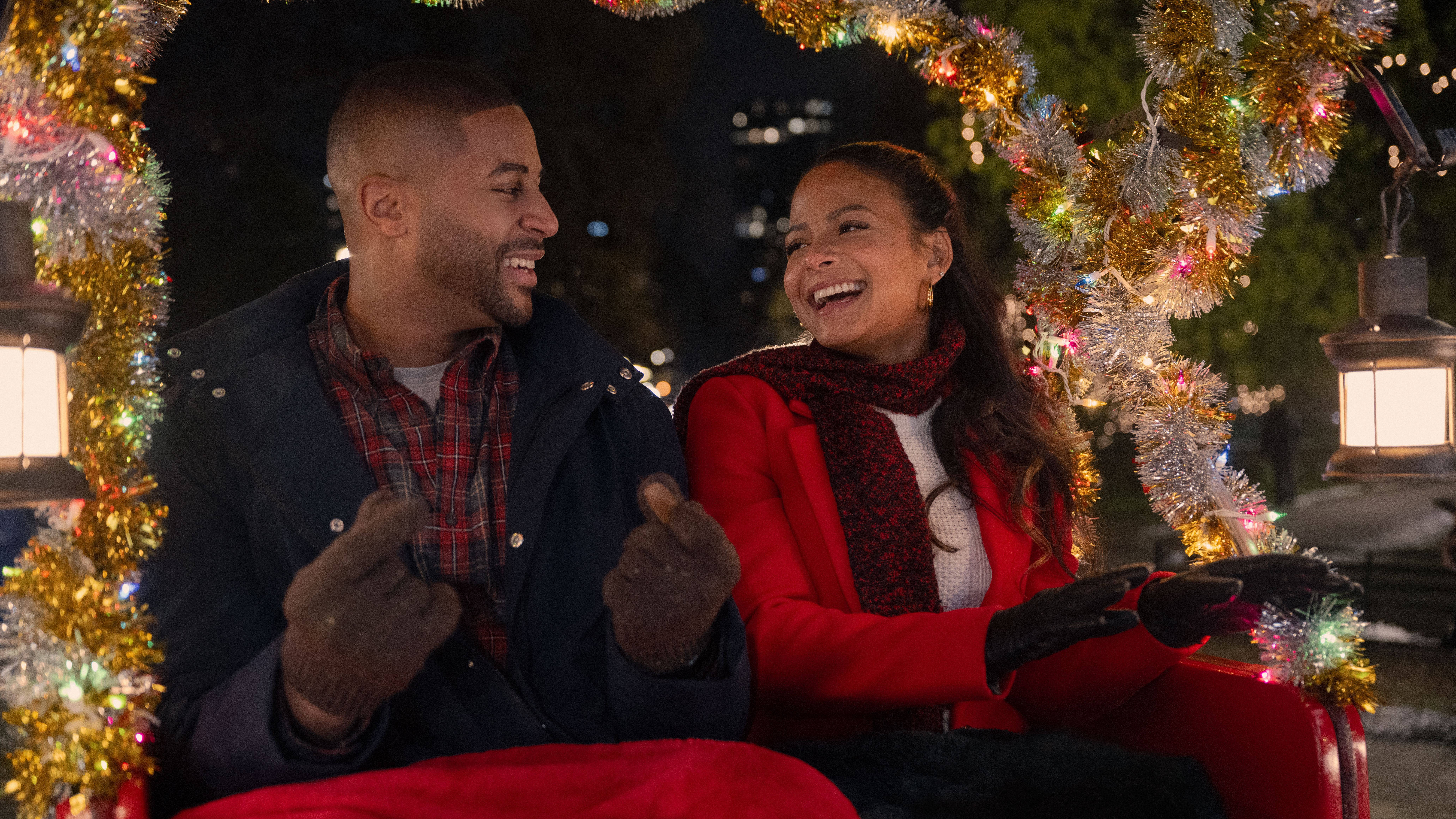 Teddy (Devale Ellis) and Layla (Christina Milian) on a sleigh ride in Netflix's "Meet Me Next Christmas"