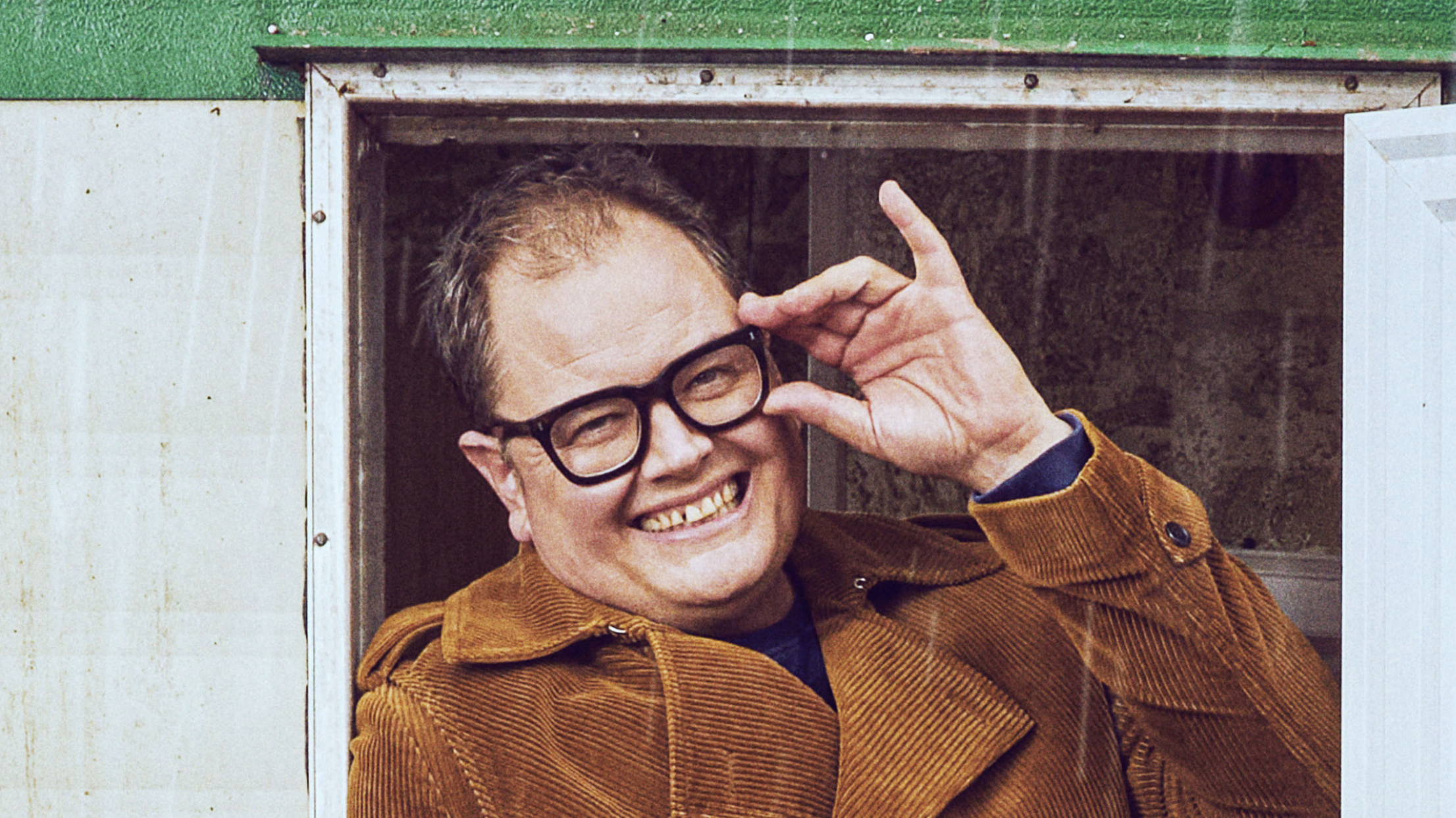 Changing Ends season 3 (2025) the autobiographical comedy based on the life of Alan Carr (pictured wearing signature black glasses) 