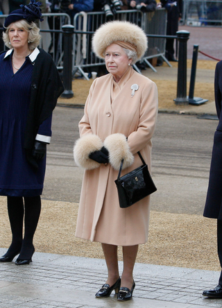 Britain's Prince Charles, Prince of Wales, left, Camilla, Duchess of Cornwall, Queen Elizabeth II and Prince Philip, Duke of Edinburgh, right, stand during a ceremony at the unveiling of a new statue of Queen Elizabeth, the Queen Mother on the Mall on February 24, 2009 in London, England