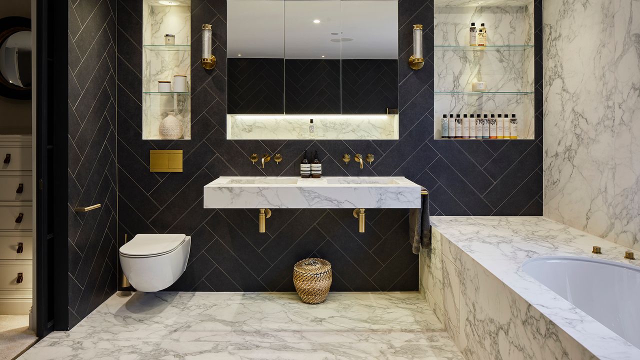 how to tile a bathroom floor, marble style and black bathroom, marble floor, twin marble basins, black wall tiles, mirrors, storage 