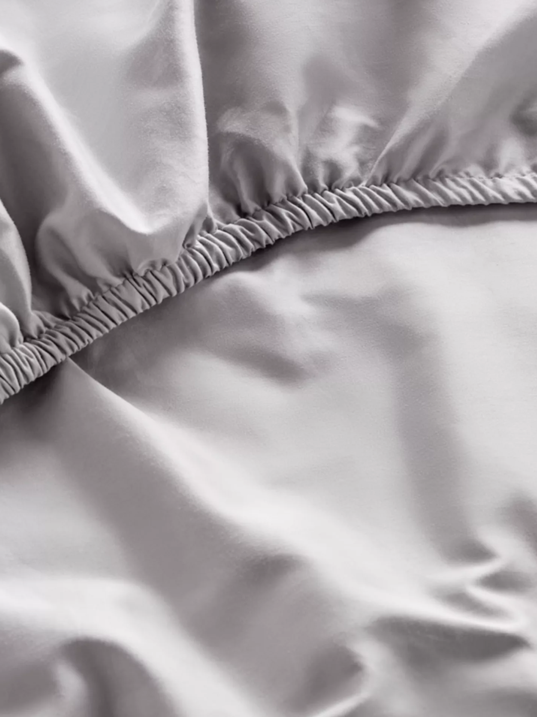 A blue sateen fitted sheet from Dip &amp;amp; Doze