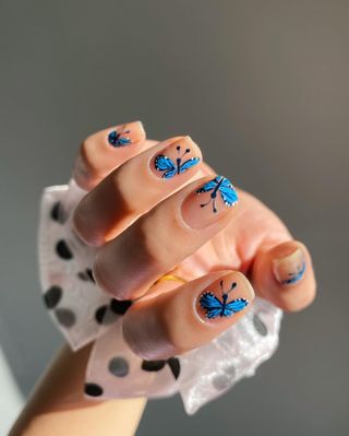 Blue butterfly nail art