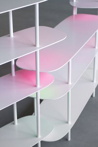 Colourful white shelves with green, pink and yellow shadows by Bijin Davis