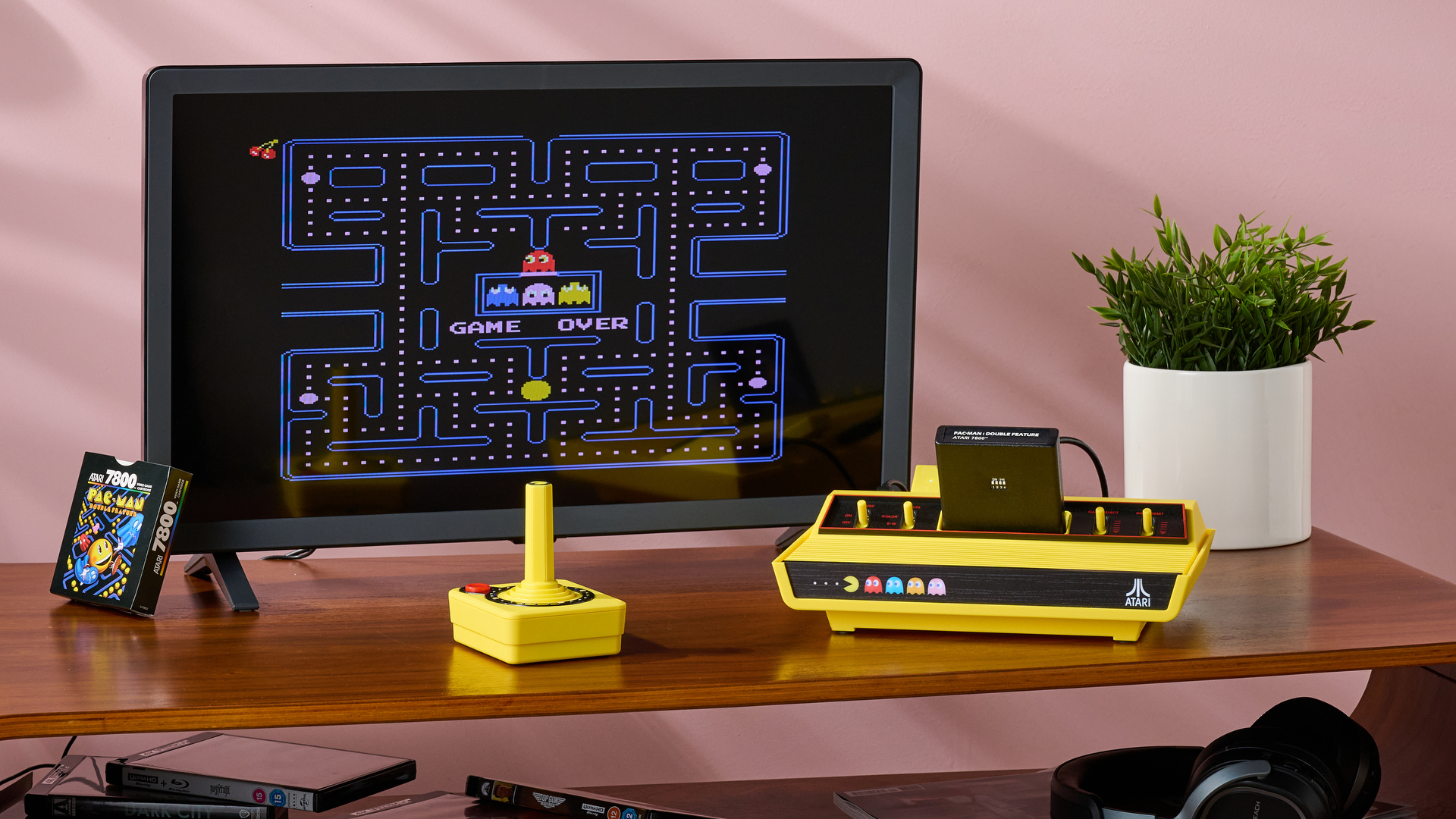 The Atari 2600+ Pac-Man Edition and CX40+ set up and plugged into the LG TQ520S-P, with Pac-Man 7800 on the screen.