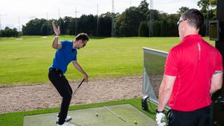 Nick Dougherty and Golf Monthly reader Andy Edom at the range at Wentworth