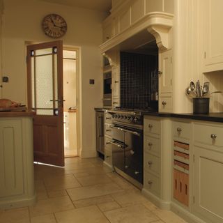 dark kitchen with kitchen storage unit