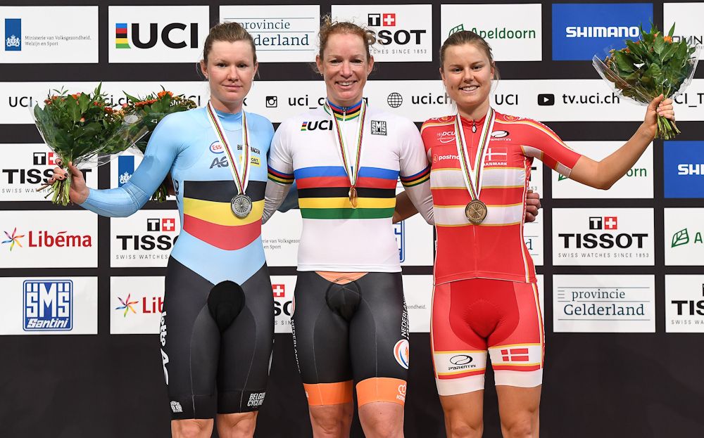 Silver medallist Belgium's Jolien D'Hoore, gold medallist Netherland's Kirsten Wild and bronze medallist Denmark's Amalie Dideriksen celebrate on the podium