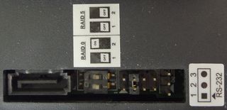 Access port on the back of the RAIDPac. From left to right: eSATA port, switch for RAID settings and maintenance pins (for re-initializing and drive setup).