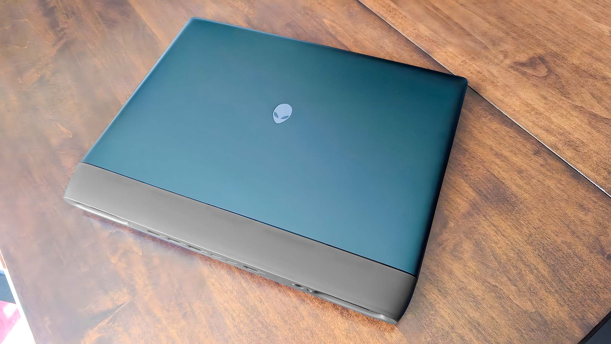 Alienware Area-51 16 Gaming Laptop closed and on a tabler.