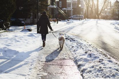 woman wearing heated body warmer on cold walk