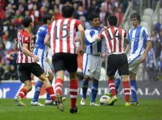 Athletic Club and Real Sociedad players clash during a Basque derby in March 2012.