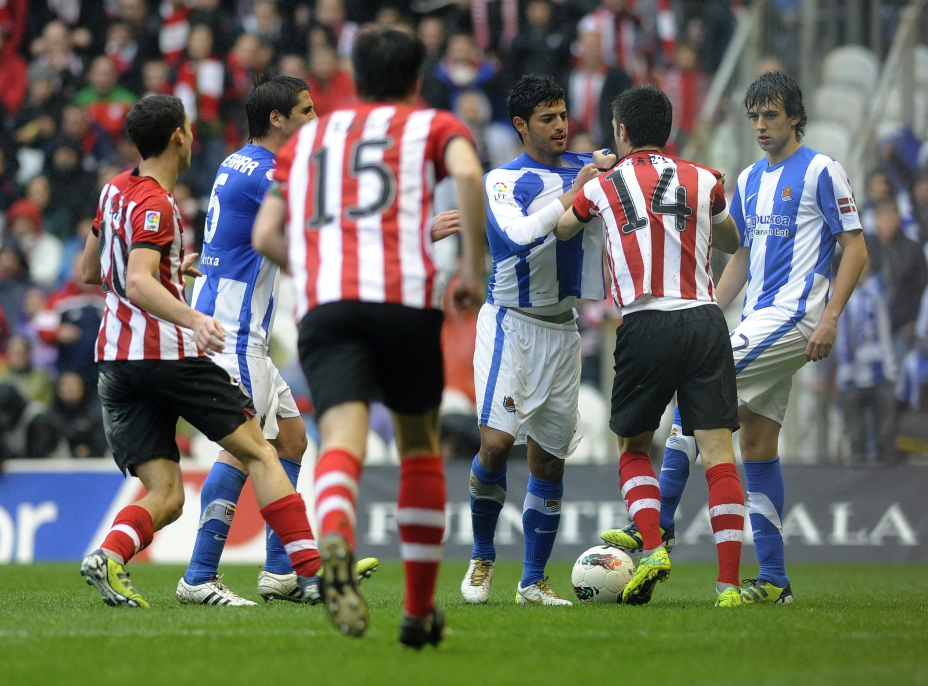 Athletic Club and Real Sociedad players clash during a Basque derby in March 2012.