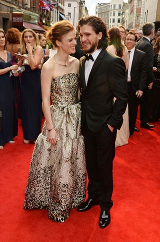 Rose Leslie (in gold dress) & Kit Harington (in black tux) at Olivier Awards