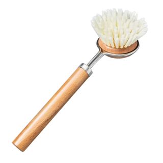 A wooden and metal dish brush with round head and white bristles