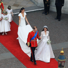 Their Royal Highnesses Prince William, Duke of Cambridge and Catherine, Duchess of Cambridge are followed by Maid of Honour Pippa Middleton, their page boys and bridesmaids and their best man Prince Harry as they prepare to begin their journey by carriage procession to Buckingham Palace following their marriage at Westminster Abbey on April 29, 2011 in London, England.