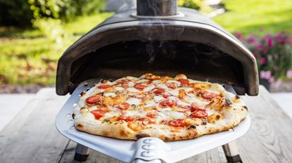 Cooking a pizza in a pizza oven