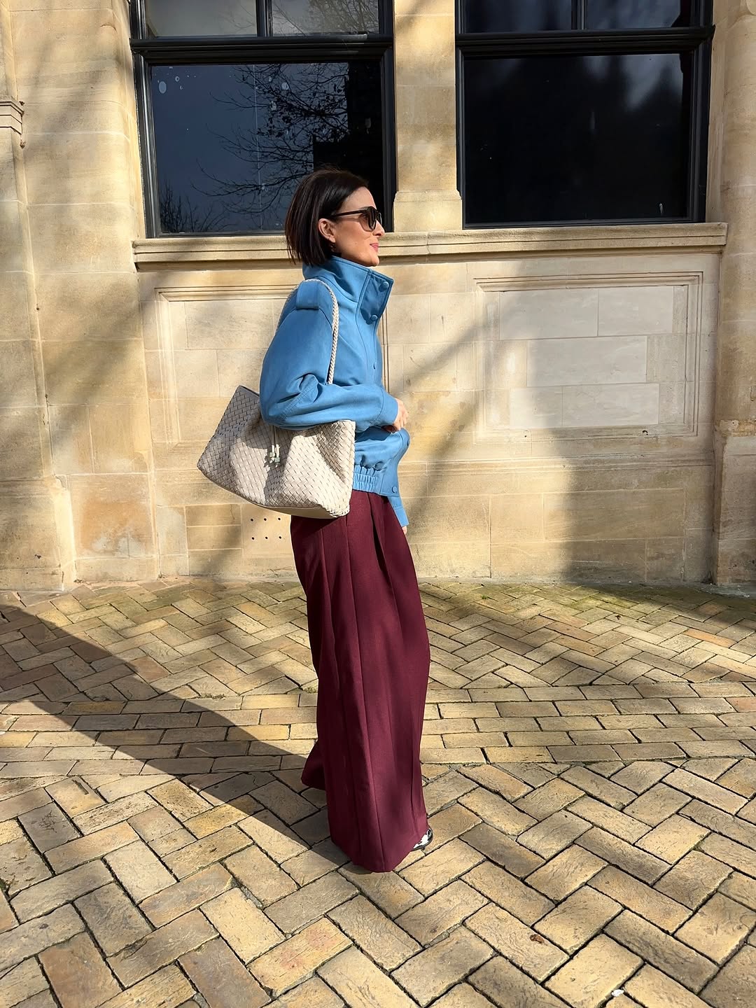 woman wearing winter to spring transitional jacket trends 2026