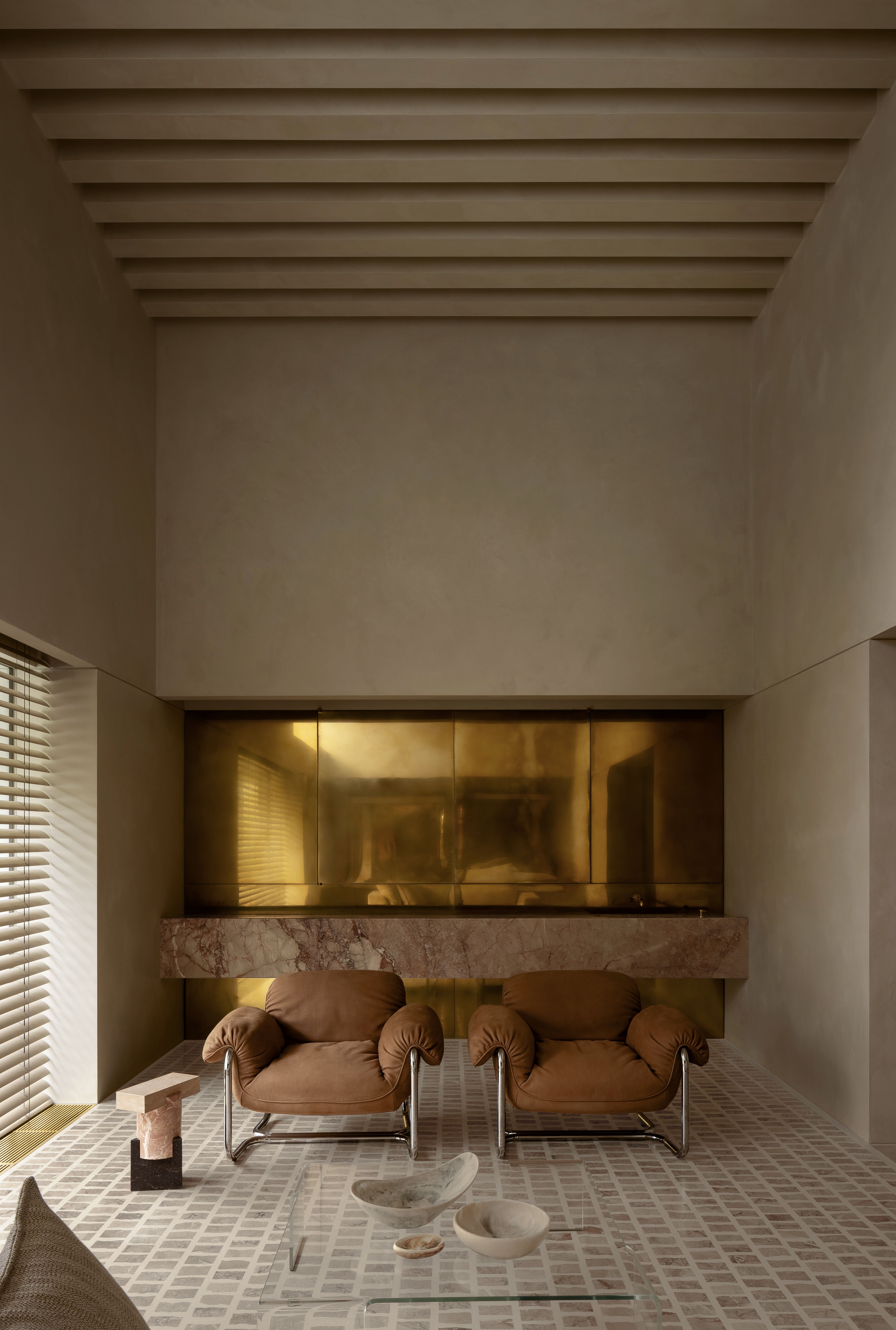 Lounge area with section of metallic cupboard / home bar doors behind