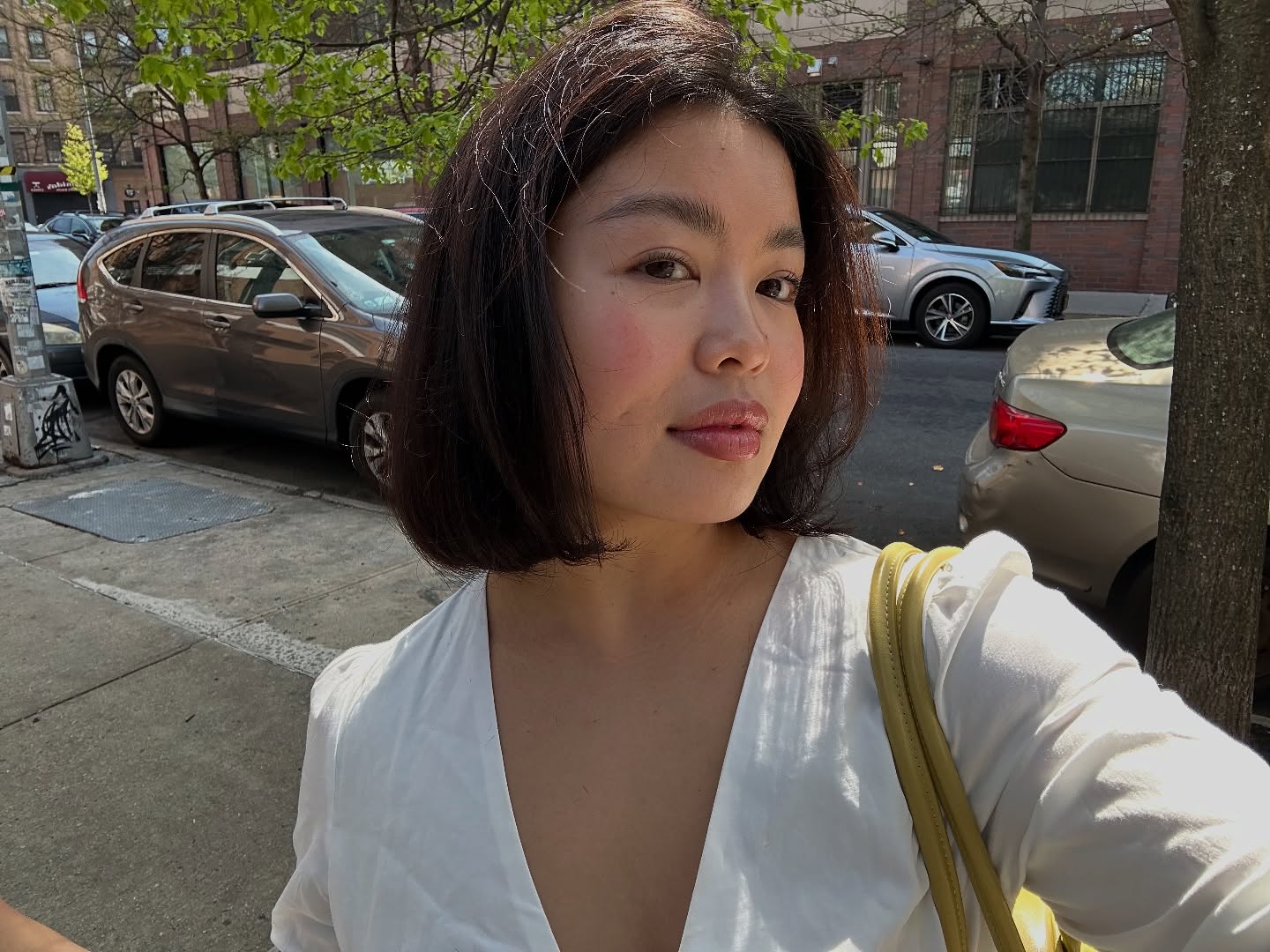 @alllisonho taking a selfie with glowing skin