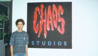 The Chaos Studios logo, alongside a young Mike Morhaime.
