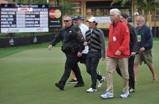Rory strides off before completing round two in 2013's Honda Classic