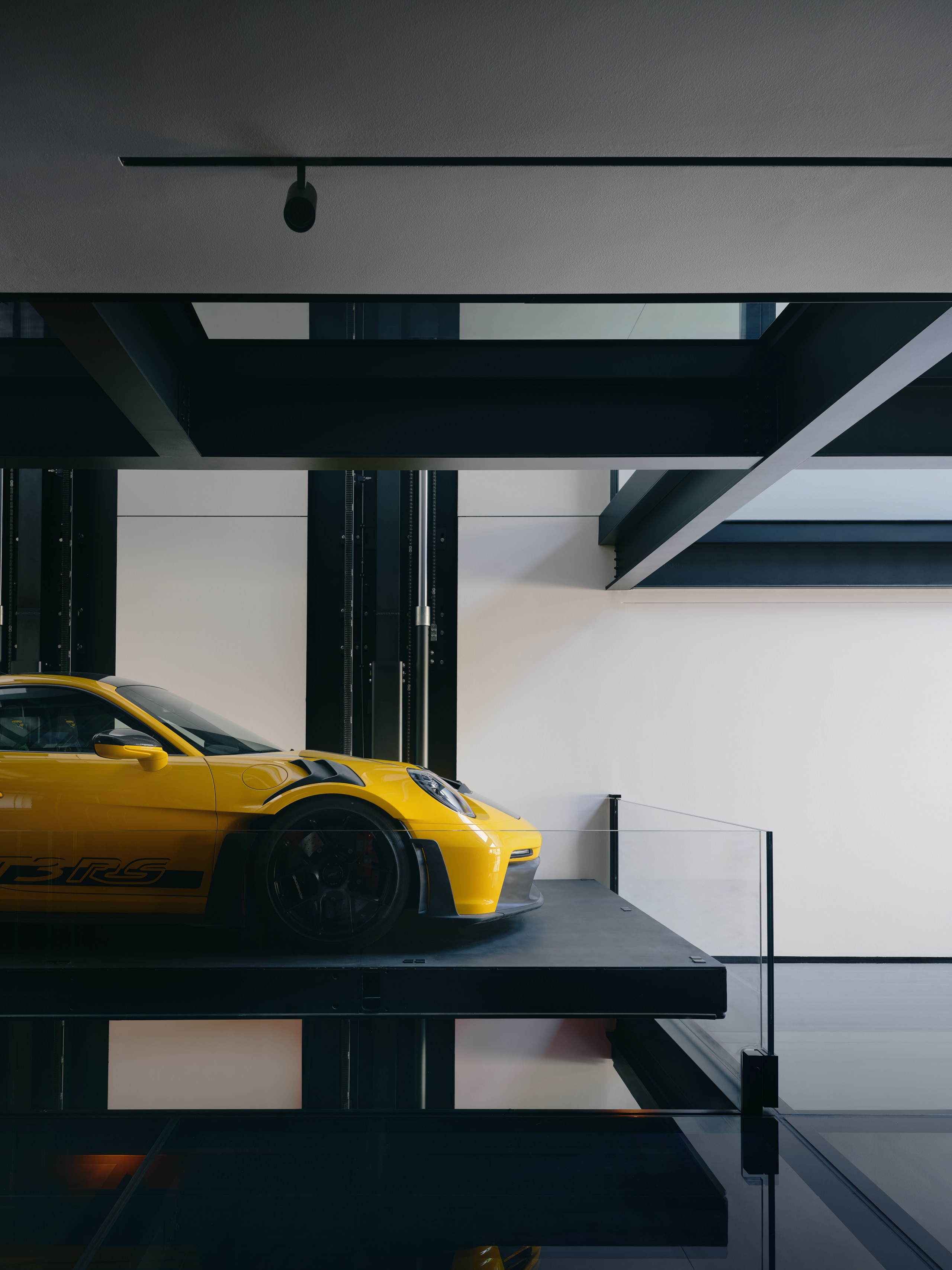 The car lift is designed to sit flush with the floor when not in use